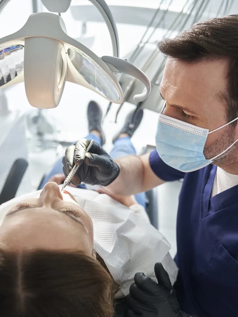 Dentist performing a gentle treatment on a patient at Lac La Biche Smiles